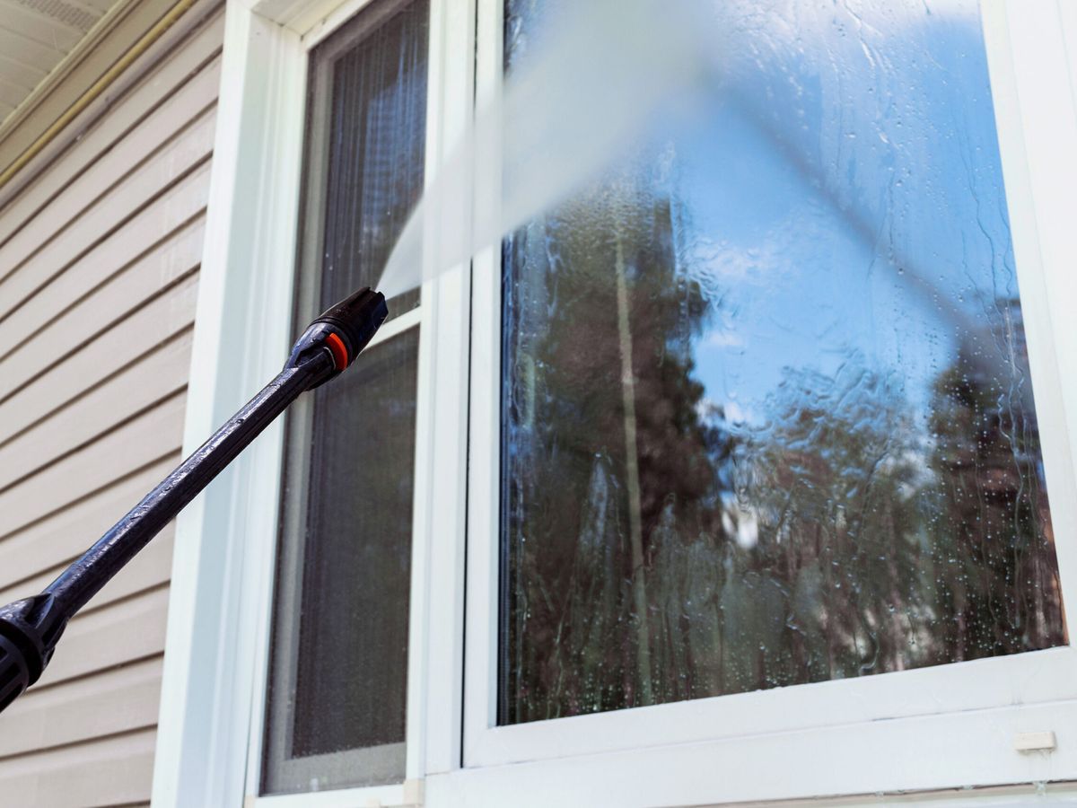 Pressure washing a window